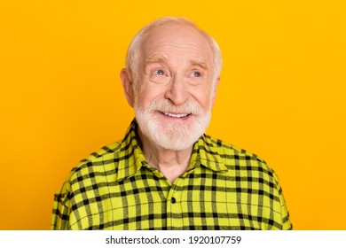 Photo of aged man happy positive smile dream dreamy look empty space grandfather isolated over yellow color background