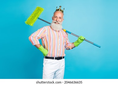 Photo of aged man happy positive smile king hold cleaning mop dust wash household isolated over blue color background - Shutterstock ID 2046636635