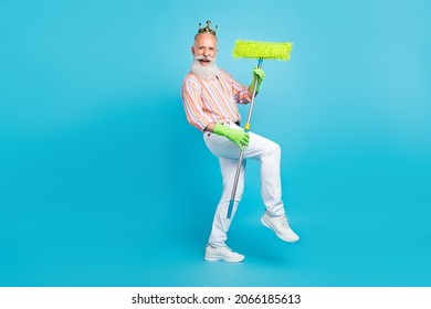 Photo Of Aged Man Happy Positive Smile Have Fun Cleaner Mop Duty Wash Housekeeper Isolated Over Blue Color Background