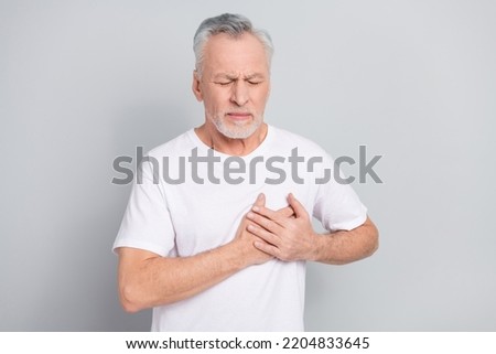 Photo of aged man touch breast suffer angina attack need medical care isolated silver color background