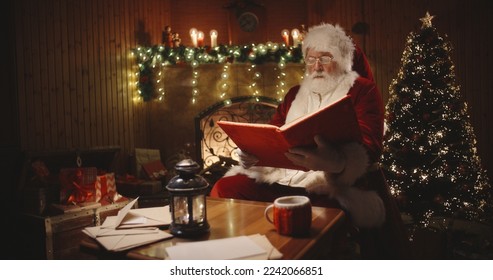 Photo of aged santa claus happy positive smile laugh read book midnight x-mas new year time december holiday indoors - Powered by Shutterstock