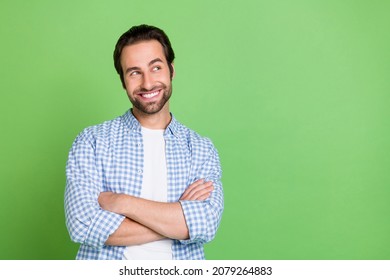 Photo of agent millennial guy crossed arms look promo wear checkered shirt isolated on green color background