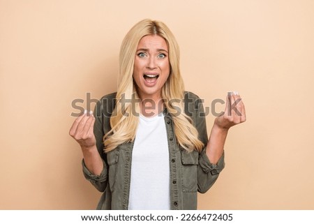 Photo of aggressive lady wear trendy clothes negative reaction bad mood pretense isolated on beige color background