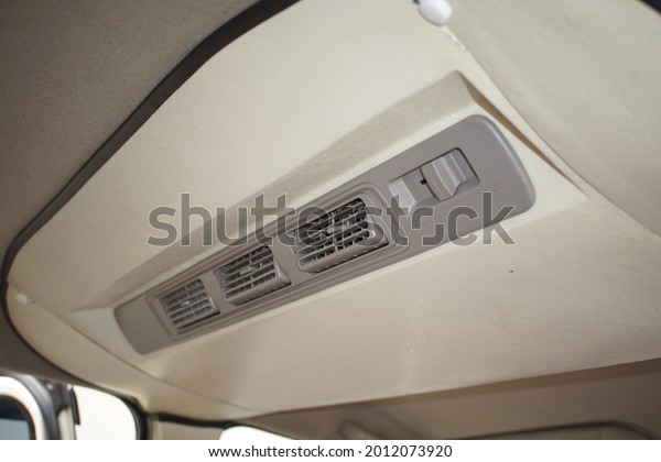 photo of the air ducts on the air conditioning\
system in a car at a car repair shop in downtown Medan.  Medan,\
Indonesia - ca 2021.