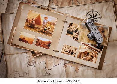 Photo Album With Photos Of Travel And Vintage Old Camera On A Background Of Old Maps