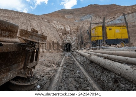 Photo along the minecart tracks of the entrance of a silver mine in the Cerro Rico in Potosi, Bolivia.
