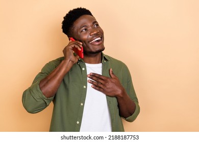 Photo Of Amazed Crazy Guy Chatting With Friend On Smart Device Isolated On Pastel Color Background