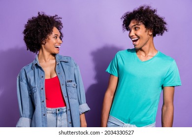 Photo Of Amazed Excited Young Dark Skin Couple Look Each Other News Cool Isolated On Violet Color Background