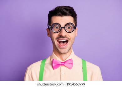 Photo Of Amazed Funky Funny Nerd Man Wear Glasses Bowtie Suspenders Isolated On Violet Color Background