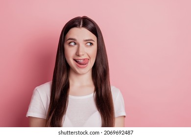 Photo of amazing lady sticking tongue out of mouth see tasty meal licking lips isolated pink color background