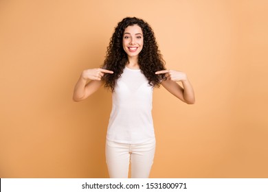 Photo of amazing pretty lady self-confidently pointing fingers on her chest advertising own personality wear white casual outfit isolated beige pastel color background