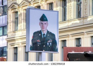 The Photo Of The American Soldier At The Checkpoint Charlie Located In The Kreuzberg District On Friedrichstraße In Berlin, Germany - 21/04/2019