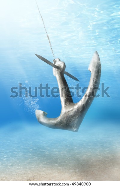 photo of Anchor being\
dropped underwater