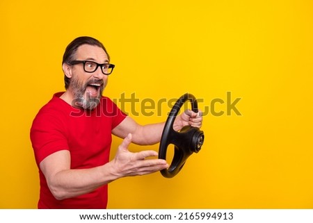 Photo of angry furious guy pensioner dressed red t-shirt glasses auto rider screaming isolated yellow color background