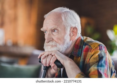 Photo Of Angry Moody Man Pensioner Wear Sitting Sofa Chin Arms Walking Cane Indoors House Room