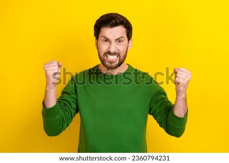 Photo of angry outraged man wear green trendy pullover man conflict fight fist isolated on yellow color background
