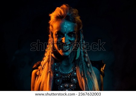Photo of angry scary mystic woman wear gothic valkyrie showing teeth isolated dark orange color background