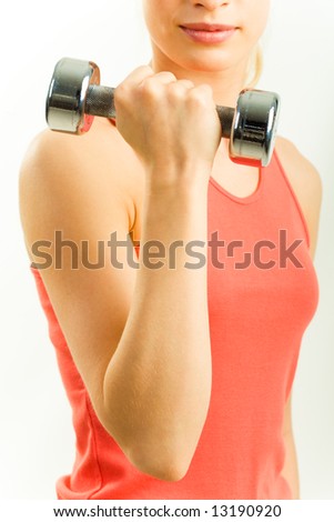 Photo of woman’s arm holding weight on a white background