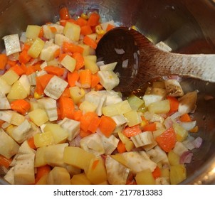 A Photo Of An Artichoke Dish With Olive Oil In A Pot