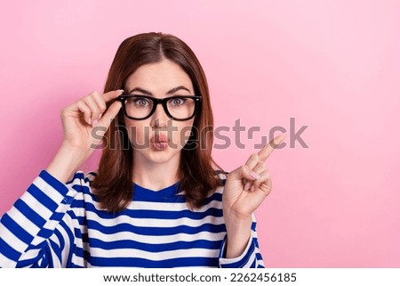 Photo of astonished clever lady wear stylish sailor shirt arm demonstrate empty space banner ad isolated on pink color background