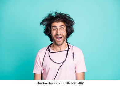 Photo Of Astonished Foolish Man Cable On Neck Excited Open Mouth Isolated On Pastel Teal Color Background