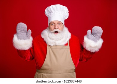 Photo of astonished santa claus wear pot holder chef cap apron red costume x-mas baking cooking isolated over bright shine color background - Powered by Shutterstock