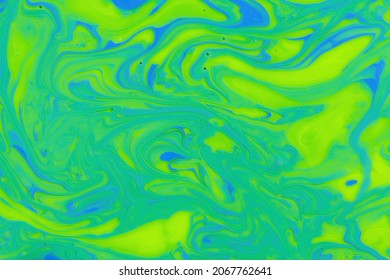 Photo attractive bright marble gradient  abstract background mixed yellow  green   blue nail polish  colorful surface