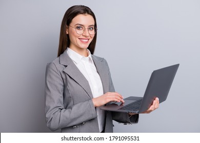 Photo of attractive business lady assistant manager worker hold notebook hands browsing working home quarantine wear specs shirt checkered blazer isolated grey color background - Shutterstock ID 1791095531