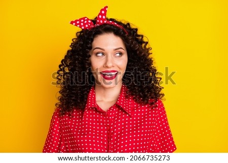 Photo of attractive charming young woman look empty space retro outfit isolated on shine yellow color background