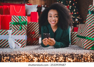 Photo of attractive cute girl wear green sweater enjoy christmas magic xmas holidays new year sale shopping indoors home room - Powered by Shutterstock