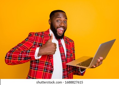 Photo Of Attractive Dark Skin Business Guy Hold Notebook Raise Thumb Finger Approve Good Wifi Speed Quality Wear Plaid Red Costume Blazer Shirt Tie Isolated Yellow Color Background