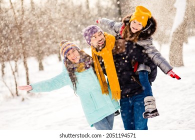 Photo Of Attractive Family Happy Positive Smile Enjoy Time Together Snow Air Fly Winter Travel Mom Dad Little Kid Outdoors