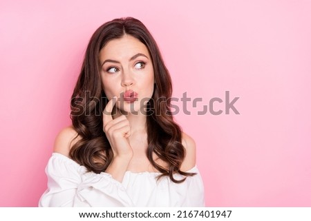Photo of attractive good mood cunning young girl look blank space brainstorming isolated on pink color background