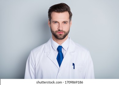 Photo Of Attractive Handsome Doc Practitioner Man Patients Consultation Not Smiling Reliable Person Virology Clinic Wear White Lab Coat Blue Neck Tie Isolated Grey Color Background