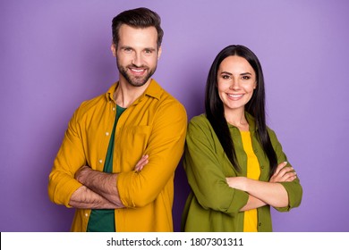 Photo attractive lady handsome guy standing side by side arms crossed confident partners one team family wear casual bright shirts outfit isolated purple color background