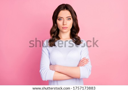 Photo of attractive pretty lady not smiling self-confident business woman arms crossed bossy look wear casual white pullover isolated pink color background