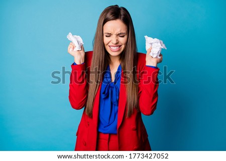 Photo of attractive professional lady holding crumpled papers arms grimacing negative emotions epic fail startup wear luxury red suit blouse shirt isolated blue color background