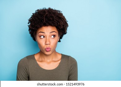Photo of attractive sweet cute nice girl pouting her lips pondering over some creative idea seeming to have acted wrong isolated over vibrant color background - Shutterstock ID 1521493976