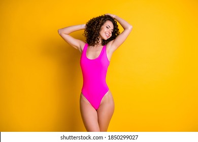 Photo of attractive wavy lady overjoyed sun exotic island all inclusive resort eyes closed sun bathing seashore wear pink swimsuit isolated bright vivid shine yellow color background