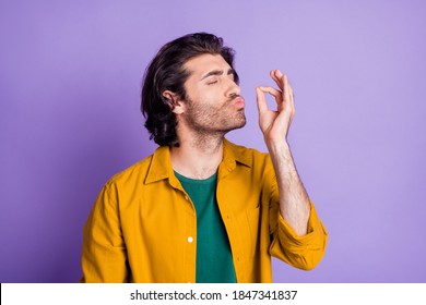 Photo of attractive young arabian man pout lips show belissimo perfect sign isolated over violet color background
