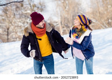 Photo of attractive young couple happy positive smile go walk run park hold hands together weekend vacation have fun