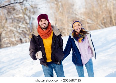 Photo of attractive young couple happy positive smile go walk run park have fun winter weekend vacation snow