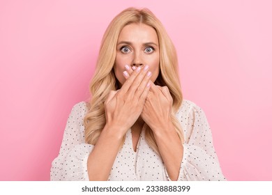 Photo of attractive young lady hands mouth closed silence muted speechless impressed reaction terrified isolated on pink color background