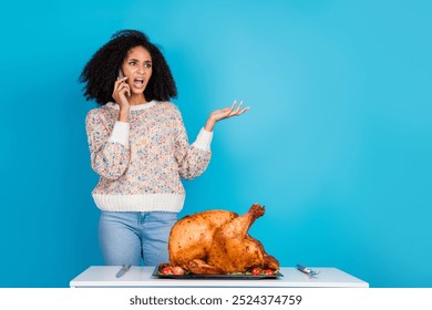 Photo of attractive young woman irritated talk phone argument celebrate thanksgiving dinner turkey isolated on blue color background - Powered by Shutterstock