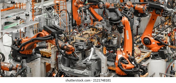 Photo of automobile production line. Modern car assembly plant. Modern and high-tech automotive industry - Shutterstock ID 2121748181