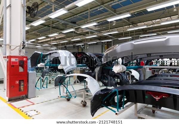 Photo of automobile\
production line. Welding car body and parts. Modern car assembly\
plant. Auto industry