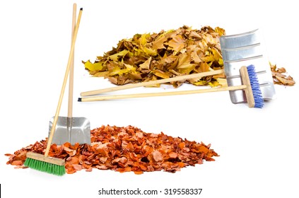 Photo Of Autumn Leaf Heaps With Cleaning Tools Isolated On White