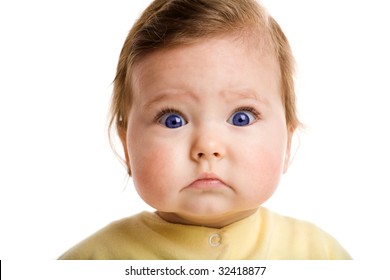 Photo of a baby, staring at camera, isolated on white