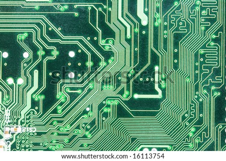 Am photo of the back side of green computer mother board.