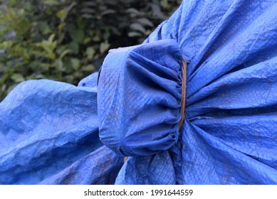 Photo Of A Background With A Car Covered With A Polypropylene Blanket. Car Detail - Rearview Mirror
